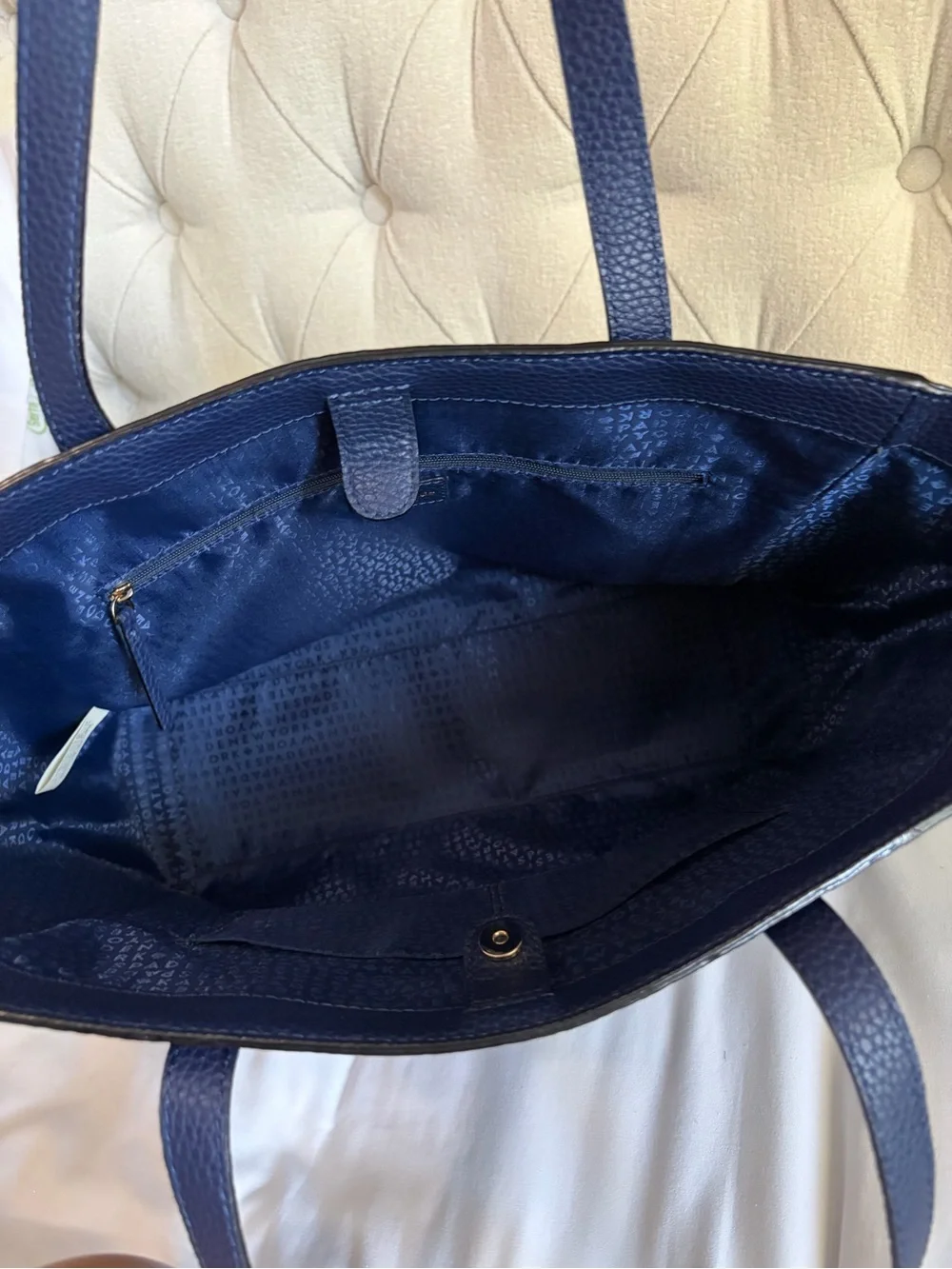 kate spade pebbled leather tote in navy with gold logo
